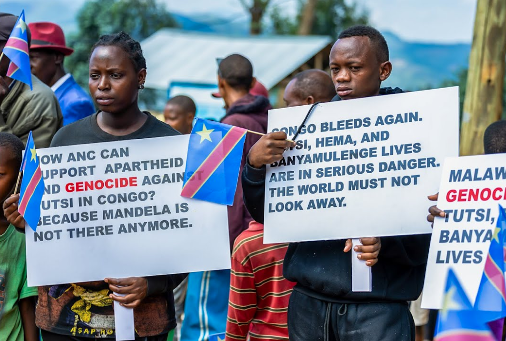 People of Congo with flags and signs, prosteintg